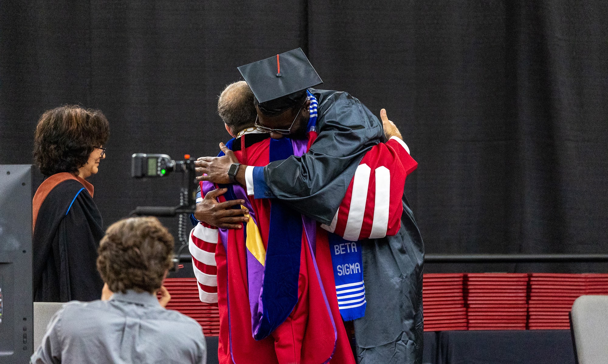 Kwaku Akuffo embraces President Weinberg after receiving his diploma
