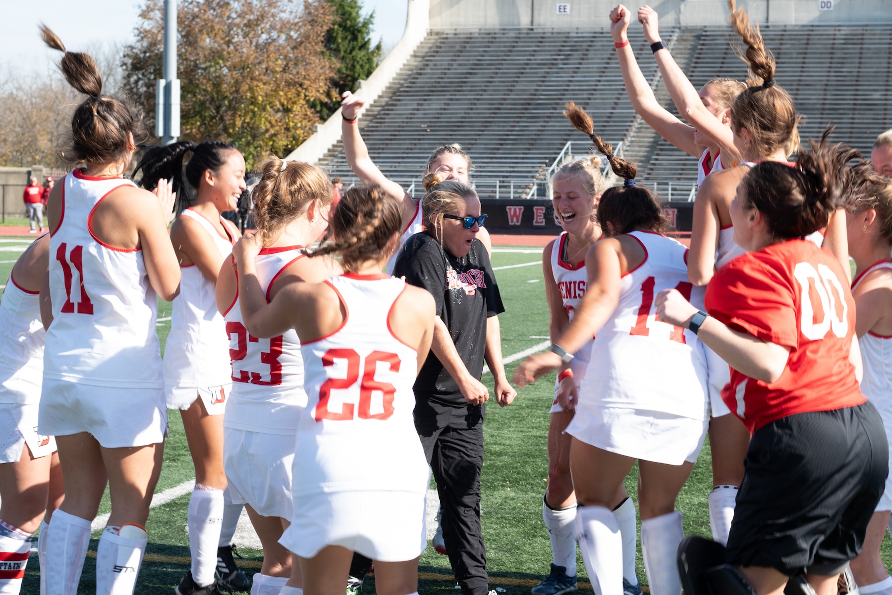 The field hockey team celebrates its dramatic overtime win in the conference tournament championship. (Ralph Schudel)