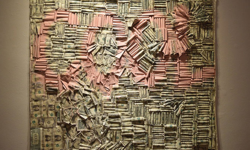 Wall of one dollar bills creating the word "Cool"