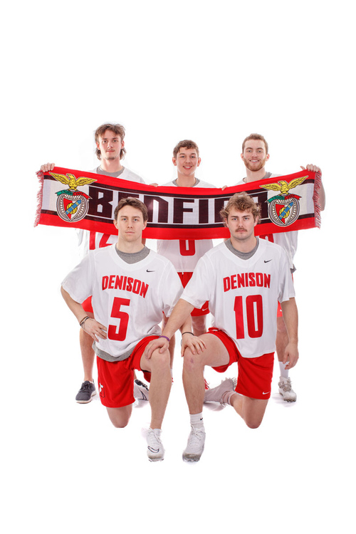 Members of the mens lacrosse team spent the 2022 fall semester in Lisbon, Portugal. They hold a supporters scarf for the Lisbon-based soccer club S.L. Benfica. (Credit: Jace Delgado)