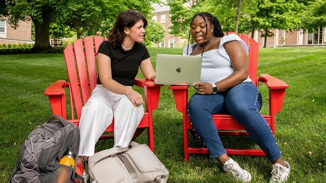 Students collaborating on the academic quad