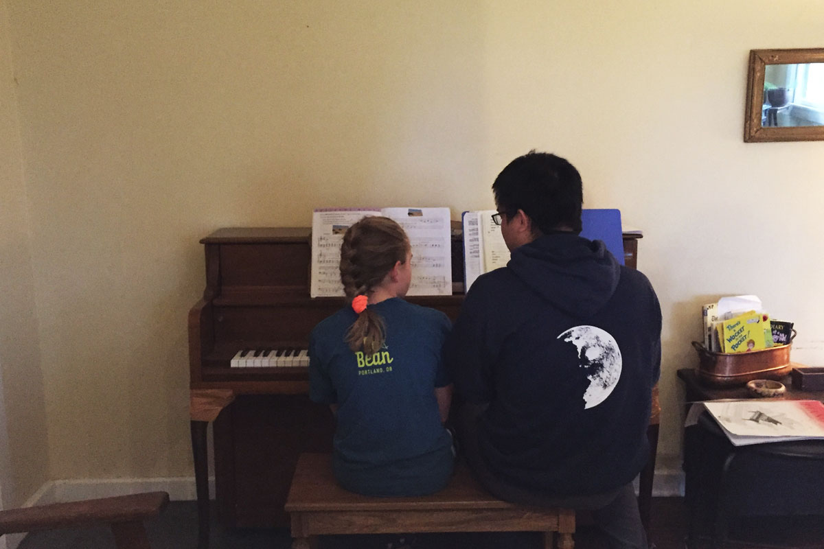 Henshaw daughter and student playing piano