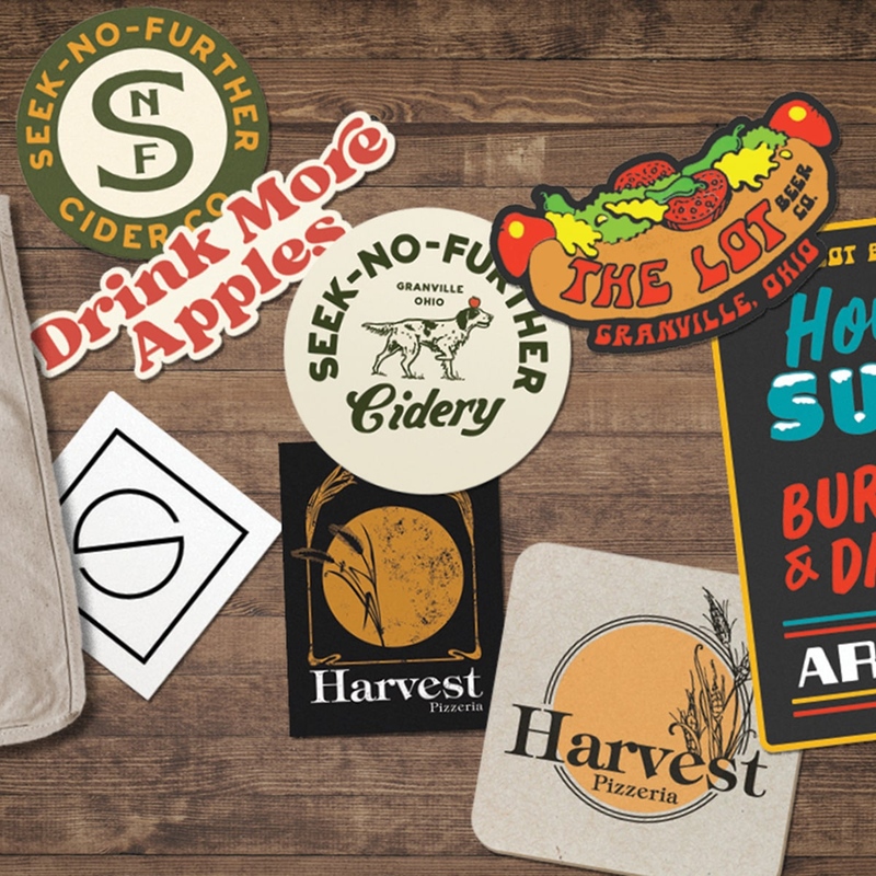 Coasters and stickers from restaurants around Granville